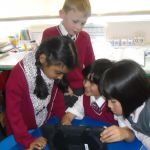 J1 children using their school iPads