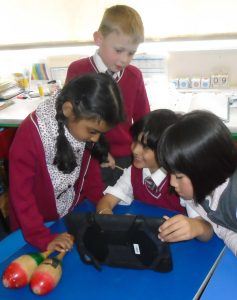 J1 children using their school iPads